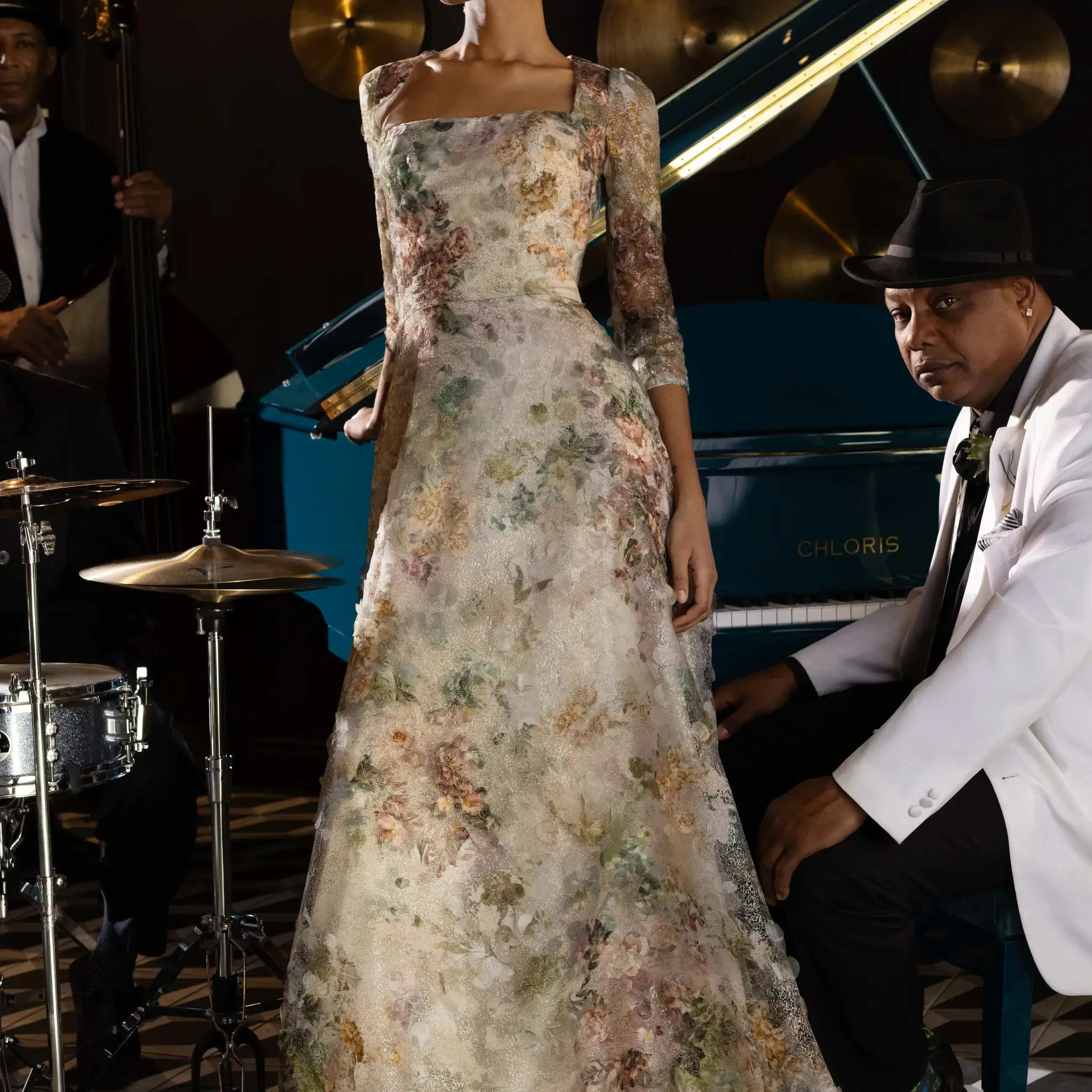 Model is wearing a floral lace A-line evening gown by sareh nouri
