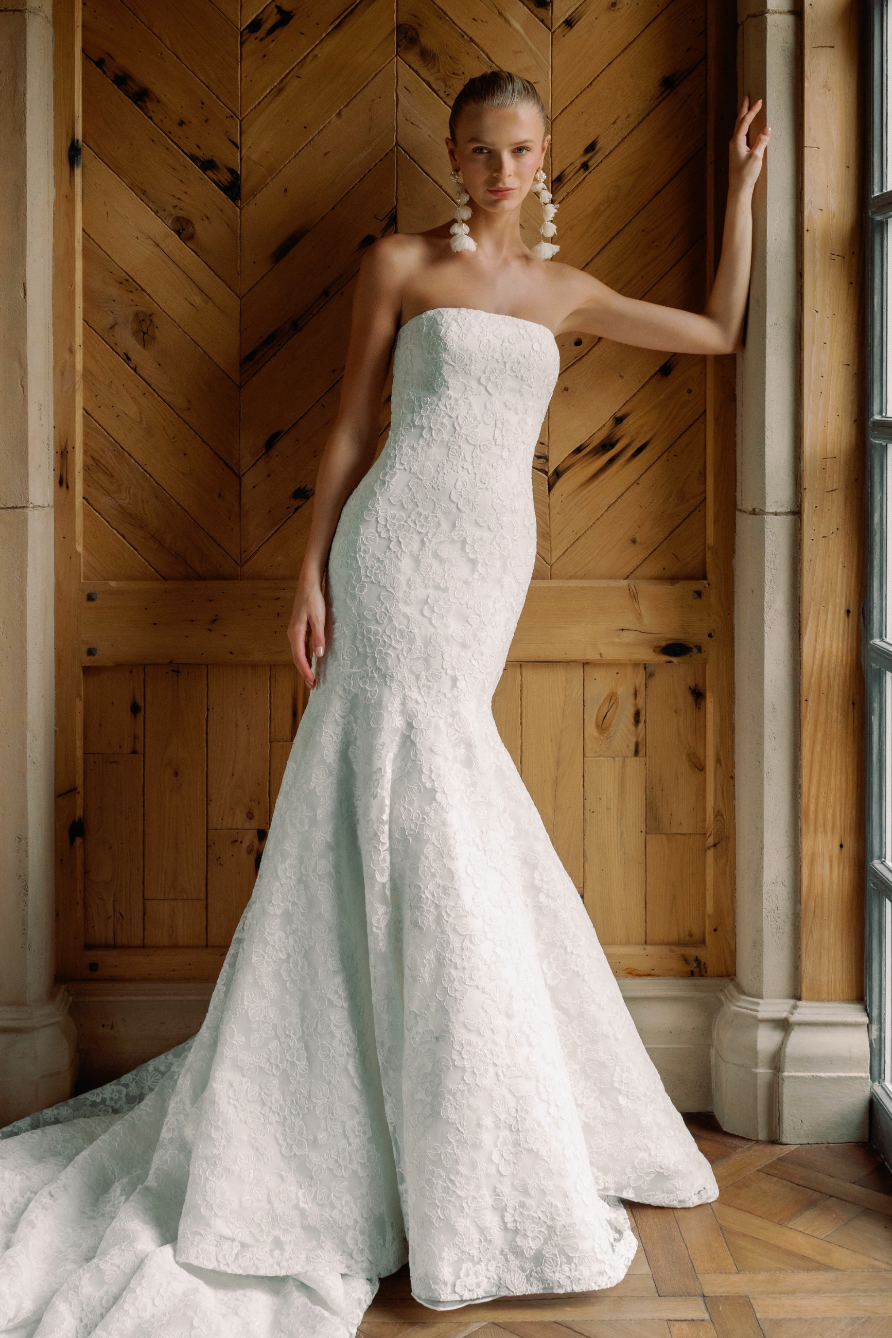 Model wearing a trumpet style dress