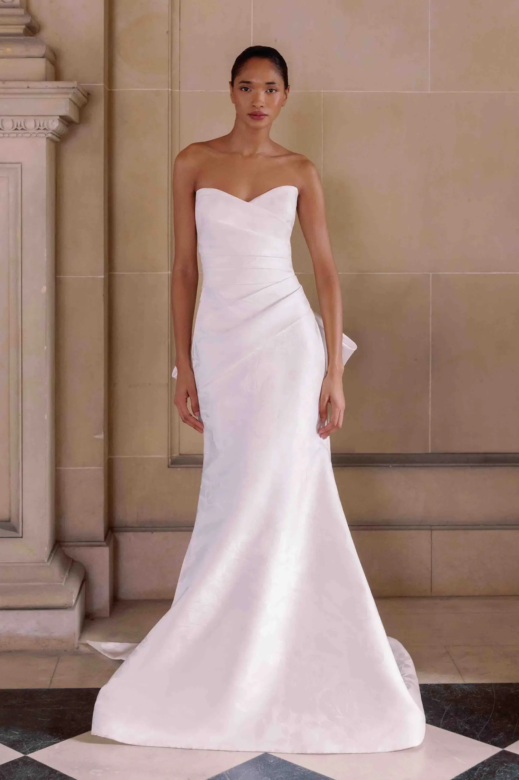 Model wearing a trumpet style dress