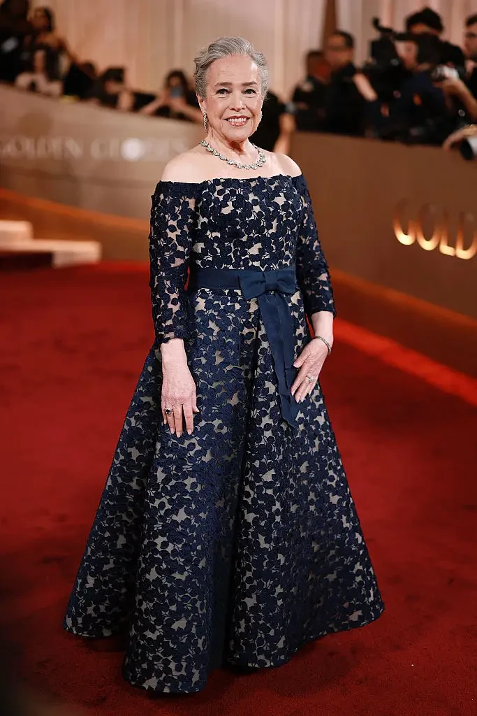 kathy bates wears an off the shoulder navy custom sareh nouri evening gown