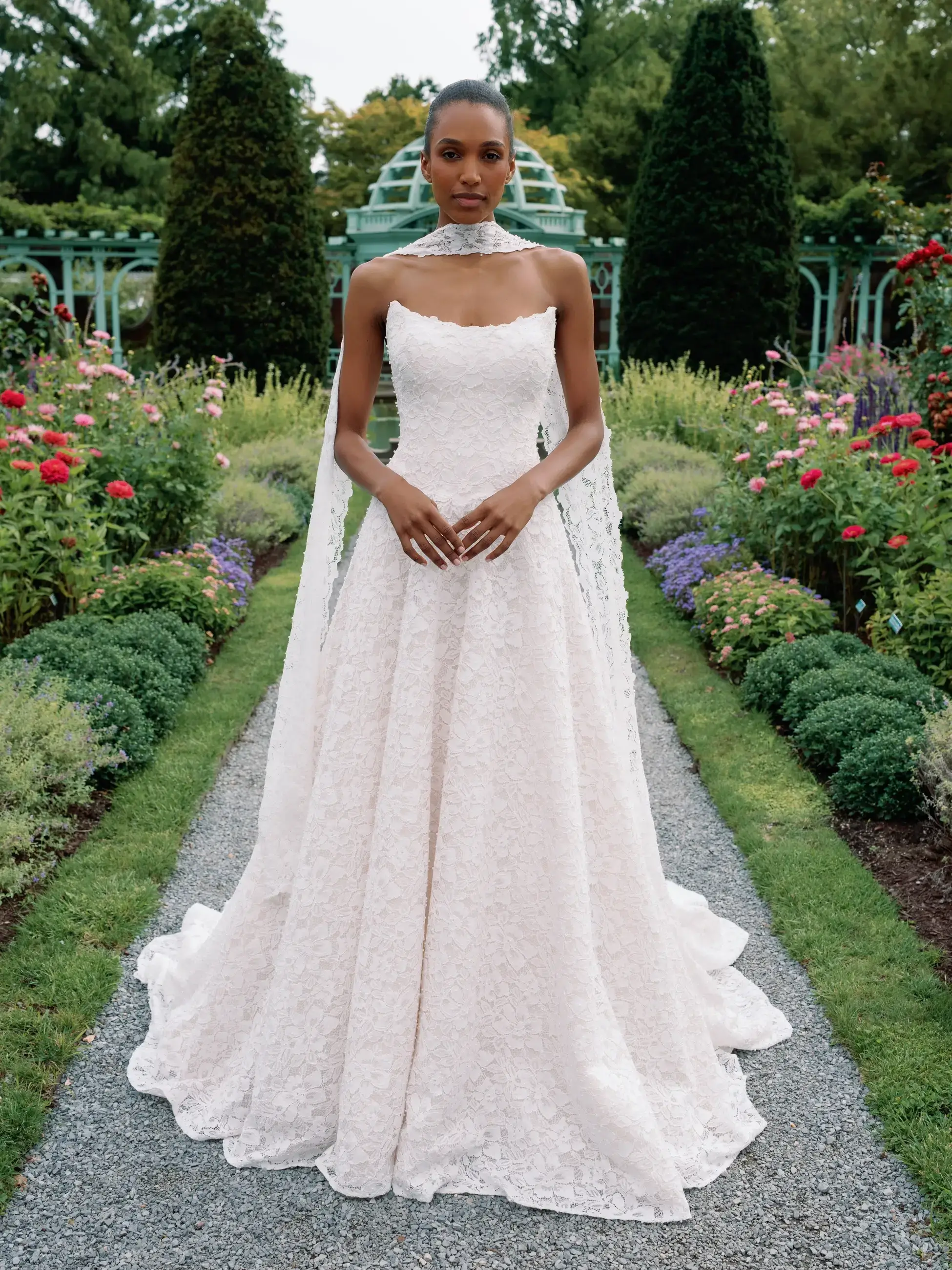 Model is wearing a cat eye neckline a-line wedding dress 