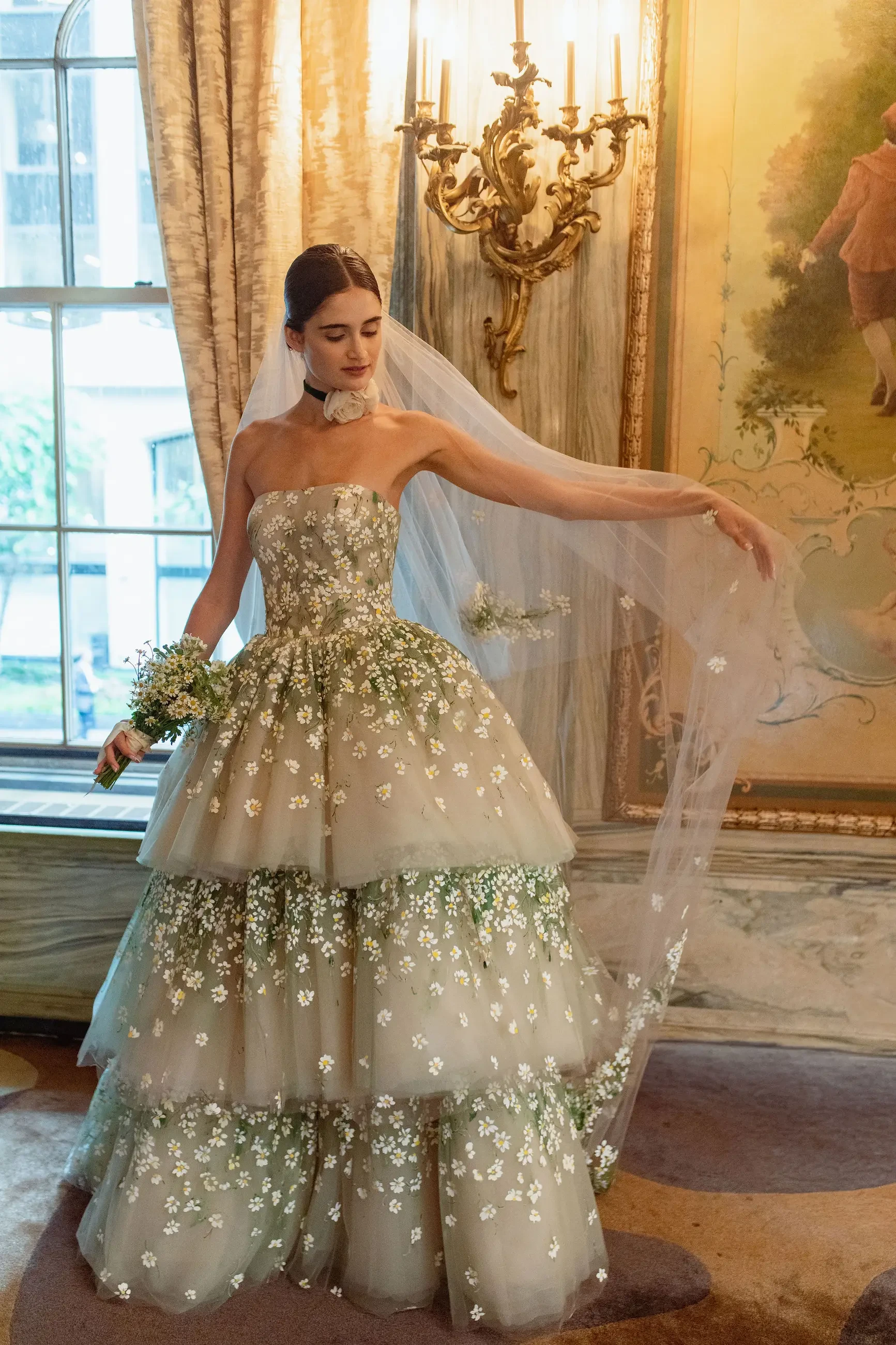image shows a model wearing the edelweiss gown from sareh nouri
