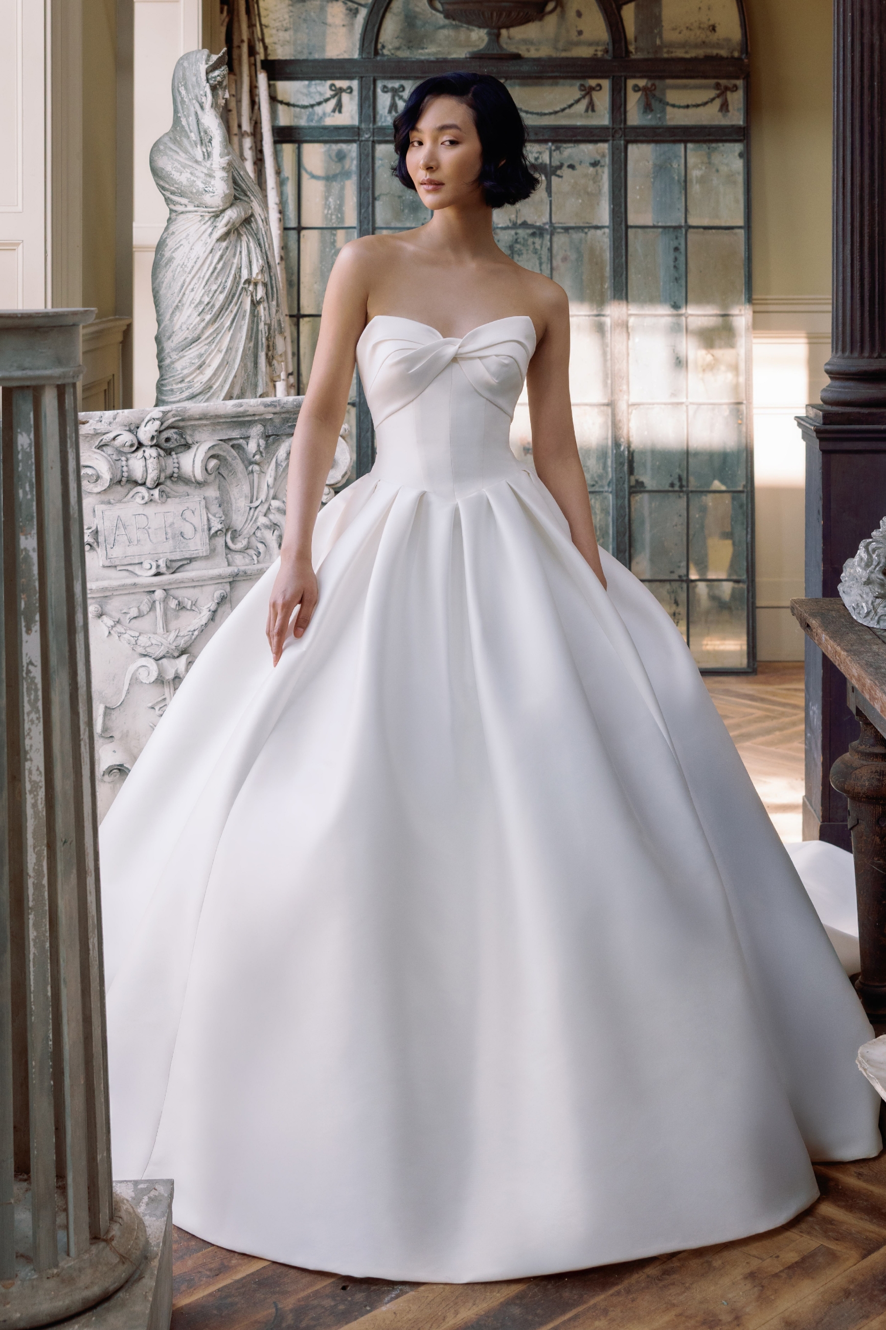 Model wearing ballgown Style dress