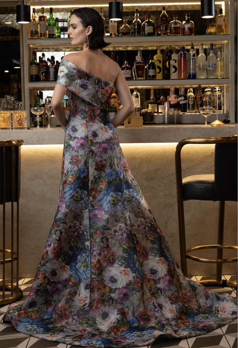 Model is wearing an A-line floral printed evening gown by sareh nouri