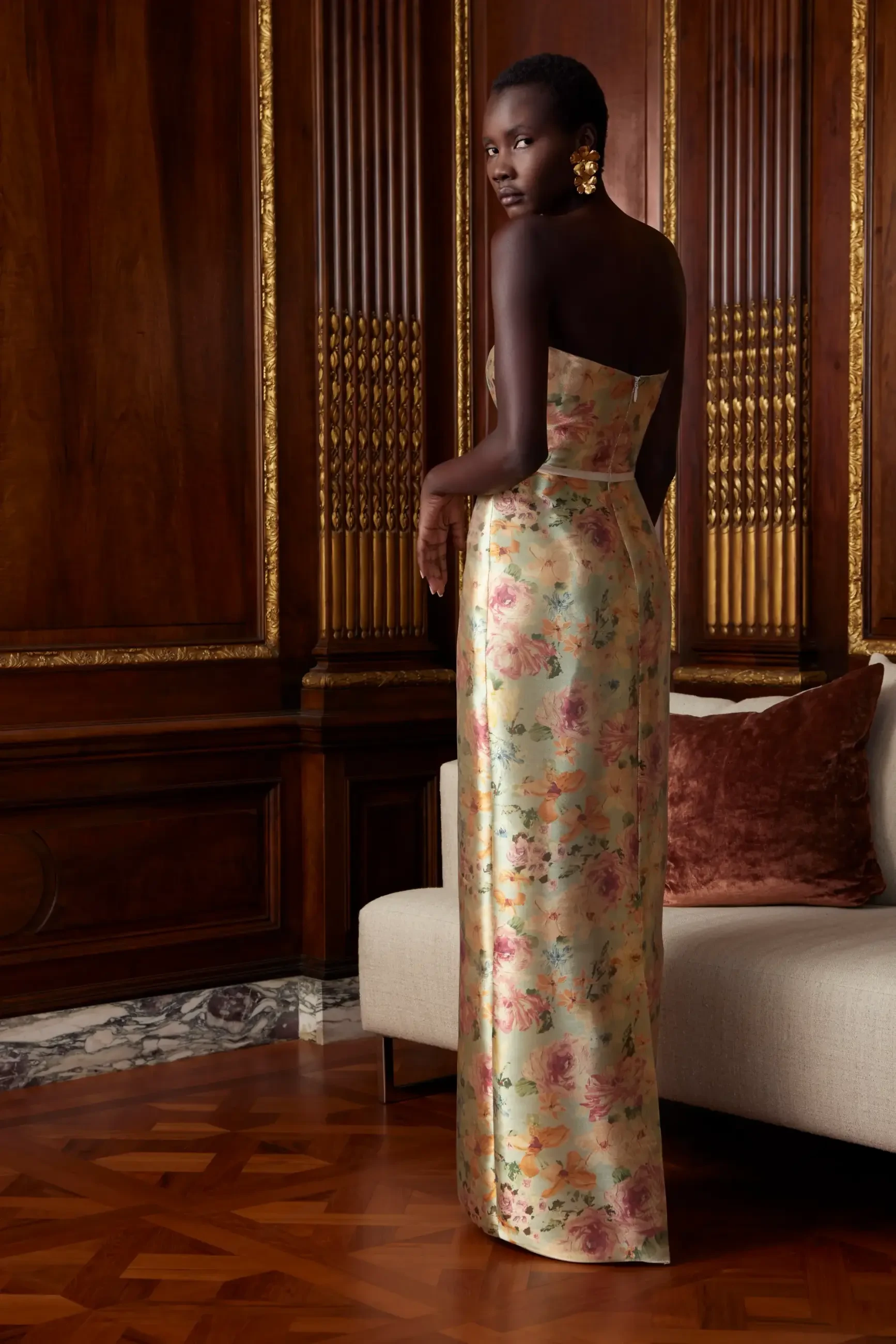 Model is wearing a printed organza column evening gown by sareh nouri
