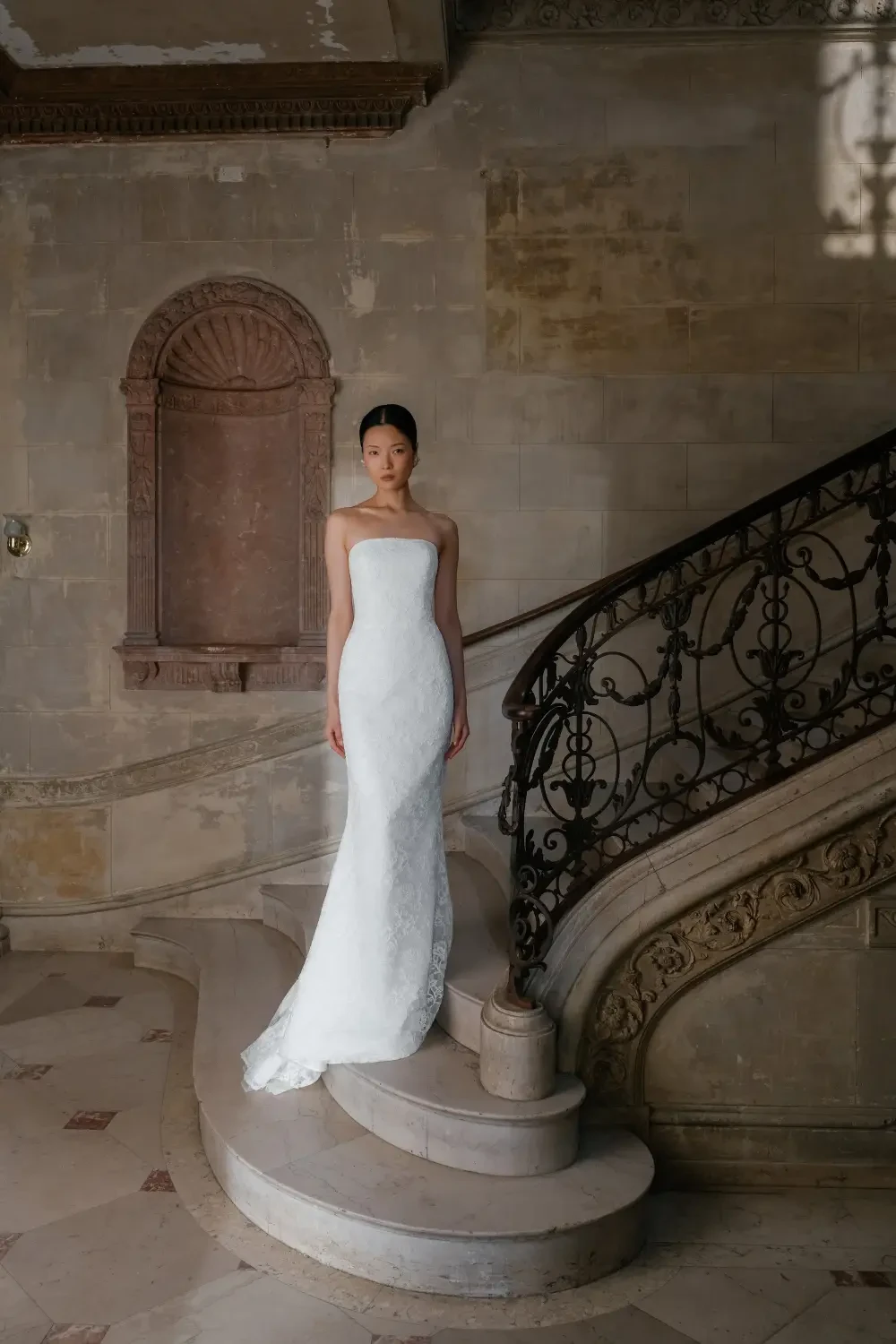 model is wearing a strapless bridal gown