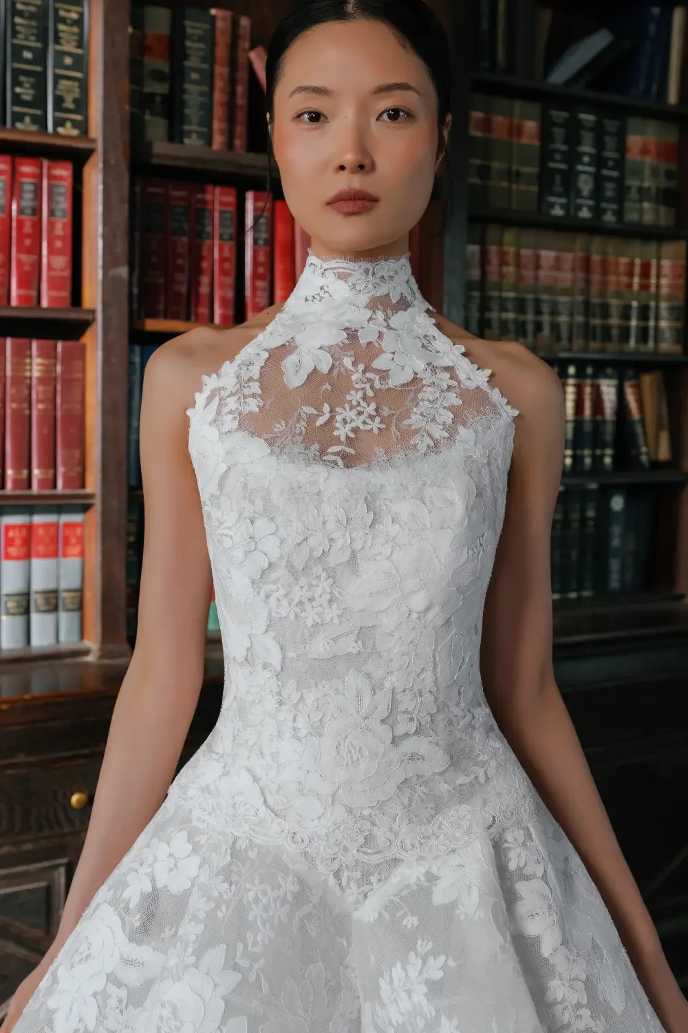 model is wearing a strapless bridal gown with detachable neckline piece
