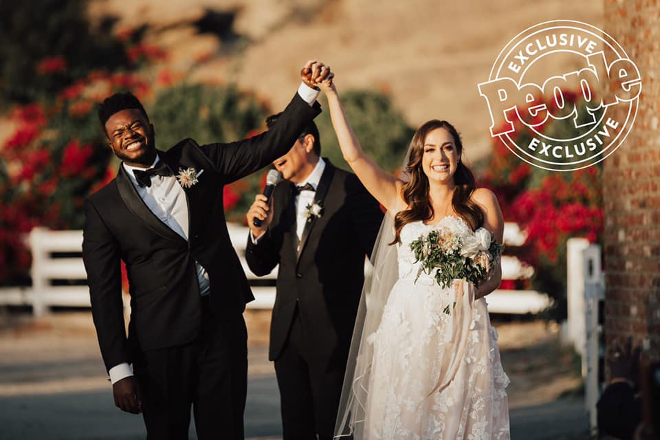 Photo of the smiling real bride and groom