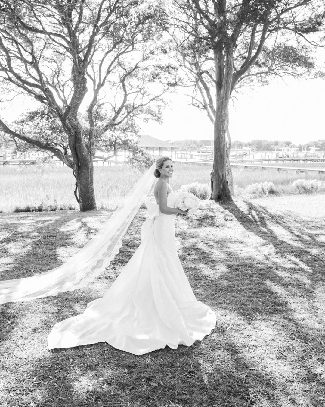 Photo of the real bride in the garden, grayscale picture